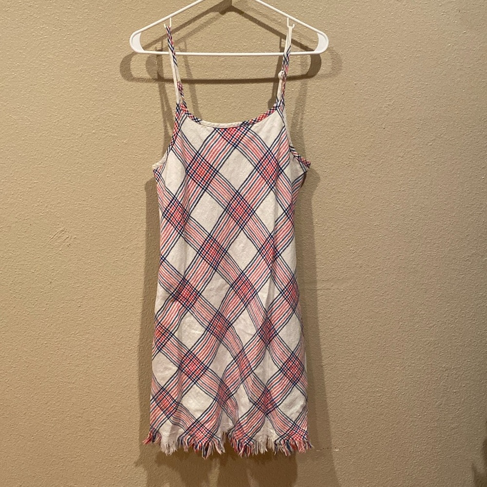 White, blue and red dress with adjustable straps and fringe.
